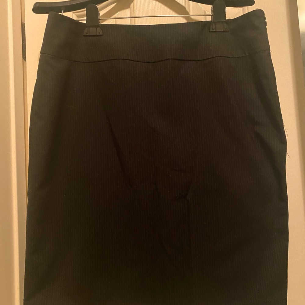 Black skirt with white pen stripes.